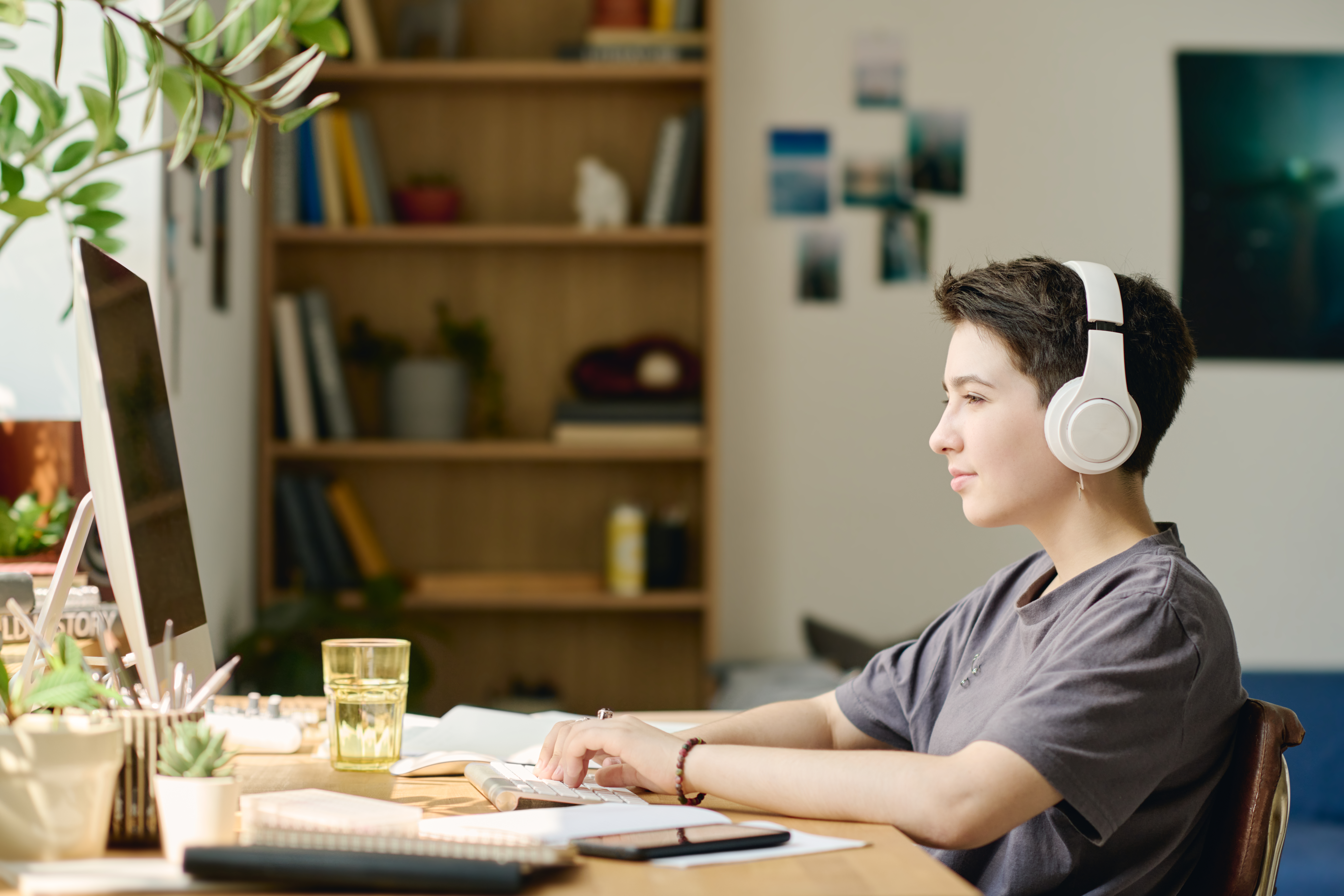 Different doesn't mean harder. It means honest. A student studying with headphones on a laptop